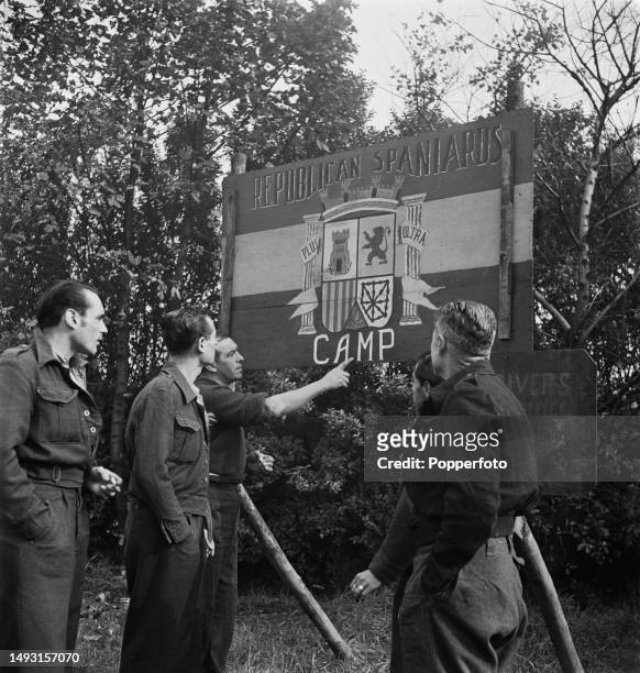 Detained Spanish Republican anti-fascist resistance fighters stand at the entrance to an internment camp in Chorley, Lancashire, England on 27th...