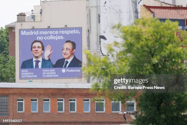 Canvas with the image of the president of Real Madrid, Florentino Perez, giving a slap to the mayor of Madrid and PP candidate for reelection, Jose...