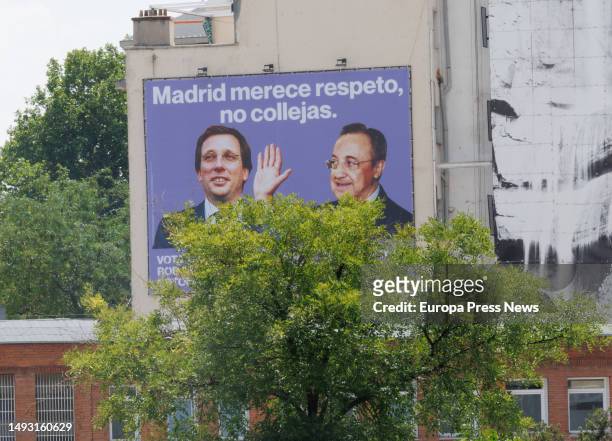 Canvas with the image of the president of Real Madrid, Florentino Perez, giving a slap to the mayor of Madrid and PP candidate for reelection, Jose...