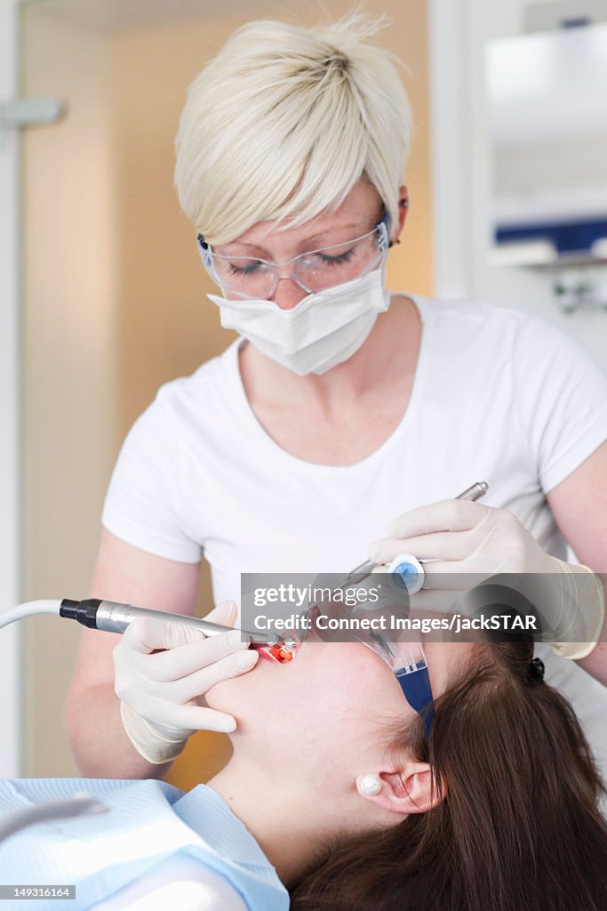 Dentist working on patients teeth