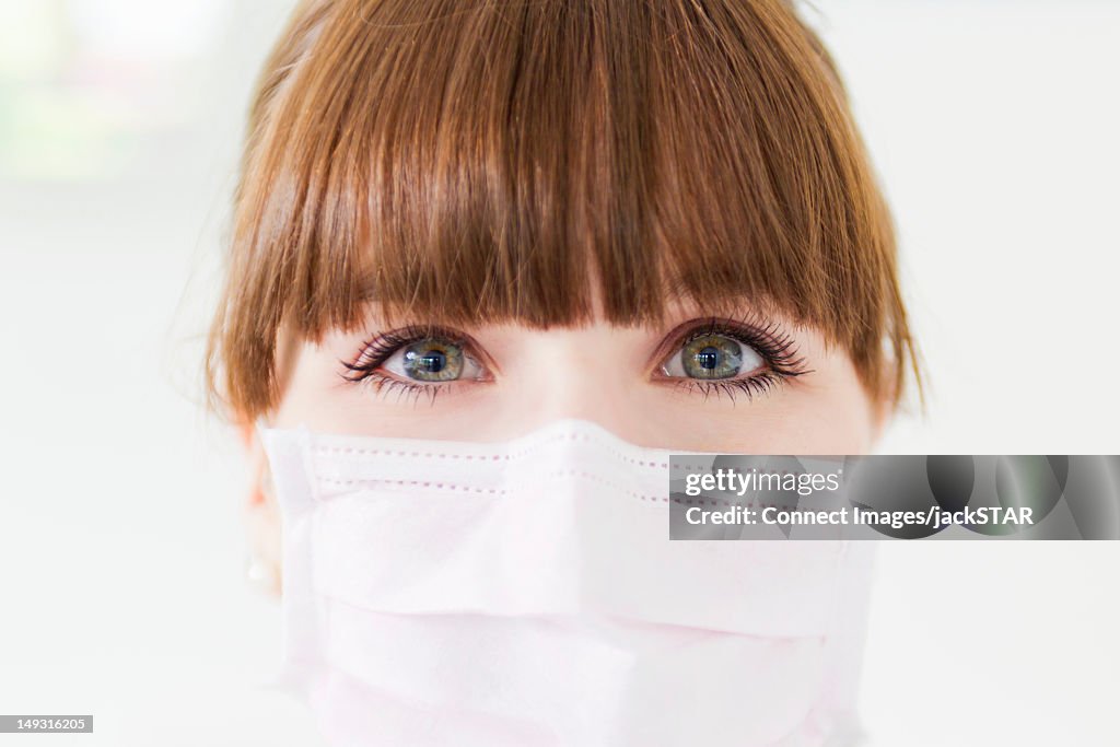 Close up of woman wearing facemask