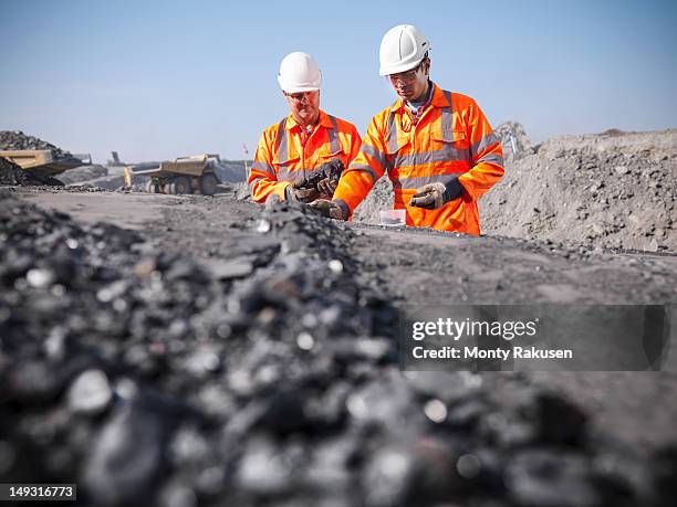 coalminers inspecting coal in an opencast colamine - natural phenomenon stock pictures, royalty-free photos & images