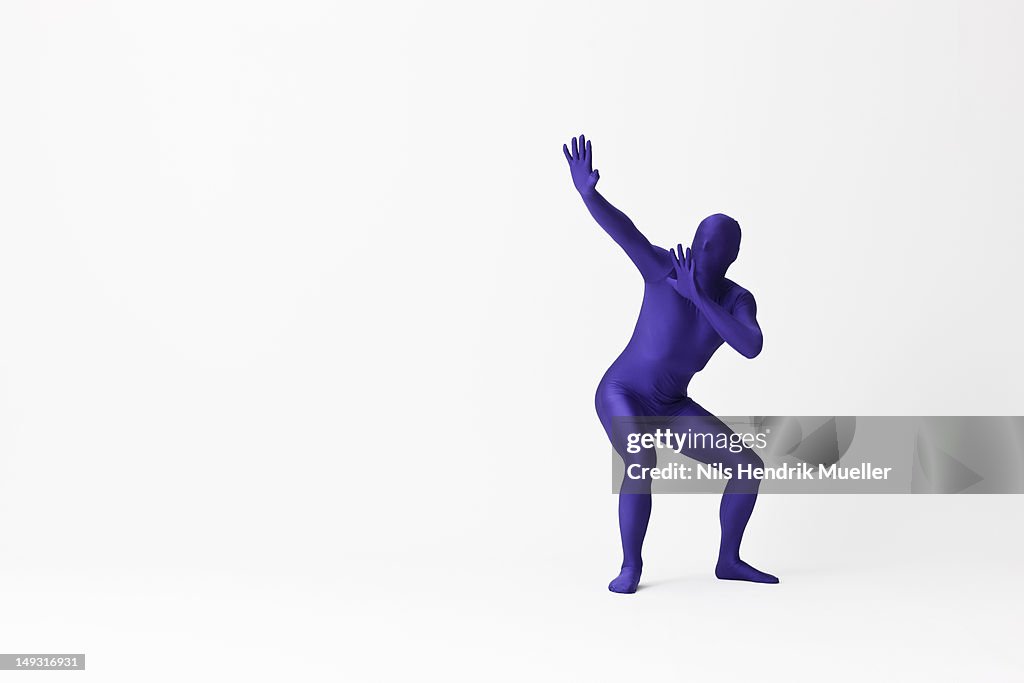 Man in bodysuit posing