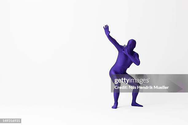 man in bodysuit posing - bodysuit stock pictures, royalty-free photos & images