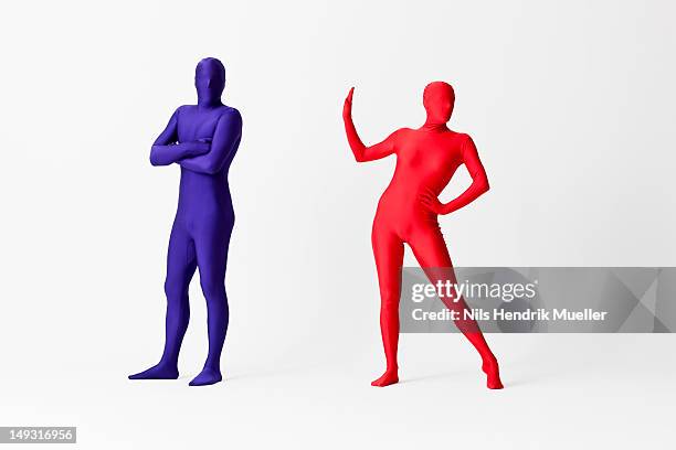 couple in bodysuits arguing - zentai stock-fotos und bilder