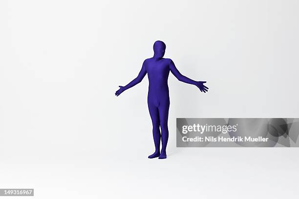 man in bodysuit shrugging - zentai stock-fotos und bilder