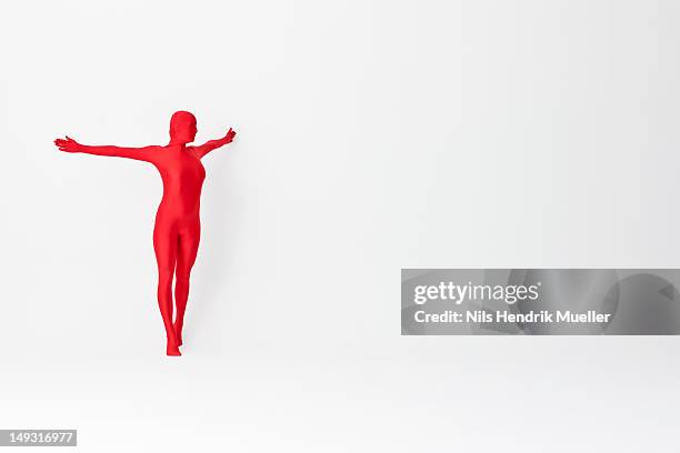 woman in bodysuit posing - zentai stock-fotos und bilder