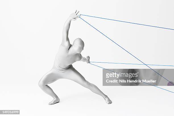 man in bodysuit playing with string - bodysuit 個照片及圖片檔