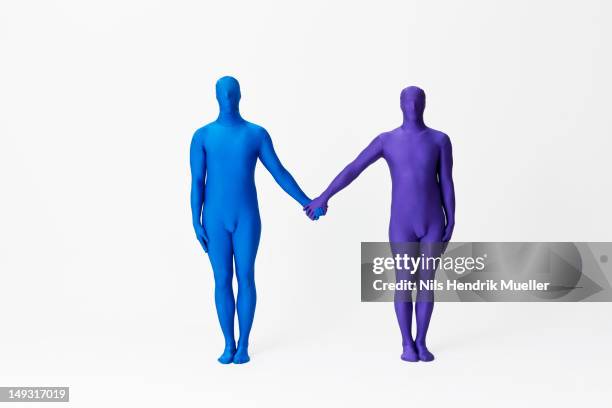 men in bodysuits making the letter m - bodysuit stock pictures, royalty-free photos & images