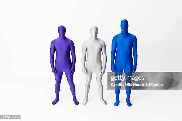 men in bodysuits standing together - white morphsuit stock pictures, royalty-free photos & images