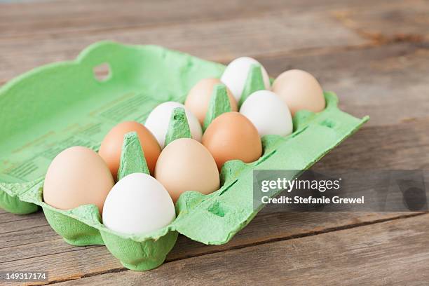 close up of carton of mixed eggs - carton of eggs stock pictures, royalty-free photos & images