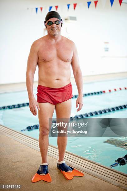 man wearing swim gear at pool - zwembroek stockfoto's en -beelden