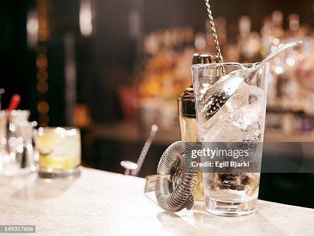 cocktail making tools on bar - cocktail strainer stock pictures, royalty-free photos & images