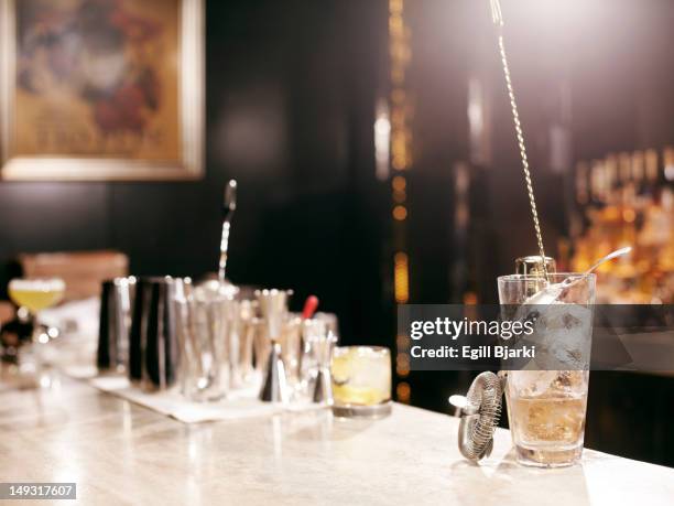cocktail making tools on bar - cocktail strainer stock pictures, royalty-free photos & images