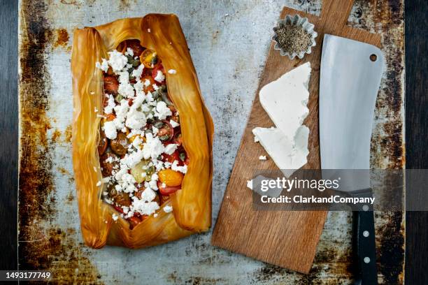 feta cheese with tomatoes and filo pastry - greek food stock pictures, royalty-free photos & images