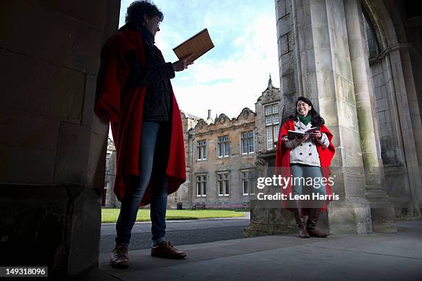 university students in traditional capes - st andrews scotland stock pictures, royalty-free photos & images