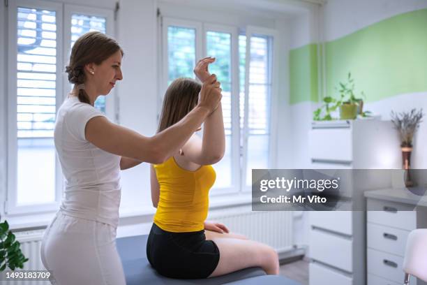 manual therapist and masseuse - scoliosis stock pictures, royalty-free photos & images