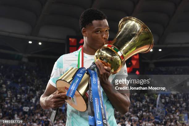 Denzel Dumfries of FC Internazionale kisses the trophy following the 2-1 victory in the Coppa Italia Final match between ACF Fiorentina and FC...