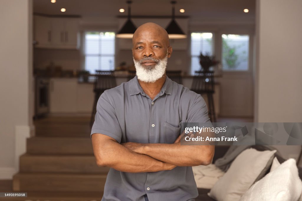 Portrait of a serious senior man at home