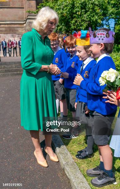 Queen Camilla meets Charles Murray and Camilla Nowawkowska during a visit to St Patrick's Cathedral on May 25, 2023 in Armagh, Northern Ireland. King...