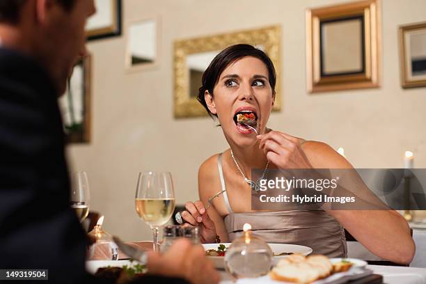 couple having dinner in restaurant - mouth open eating stock pictures, royalty-free photos & images