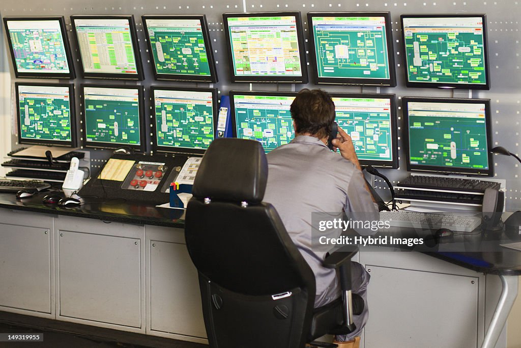 Man working in security control room