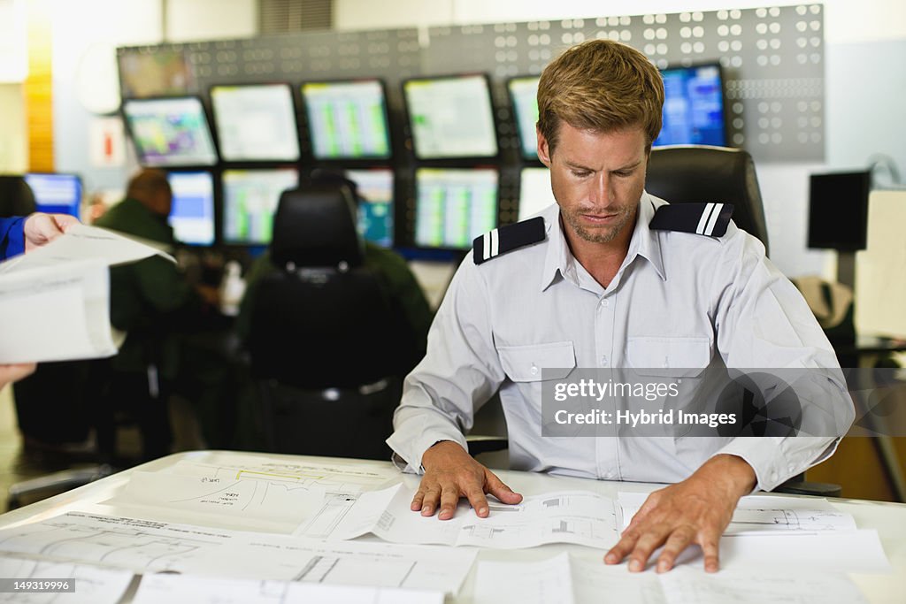 Man working in security control room