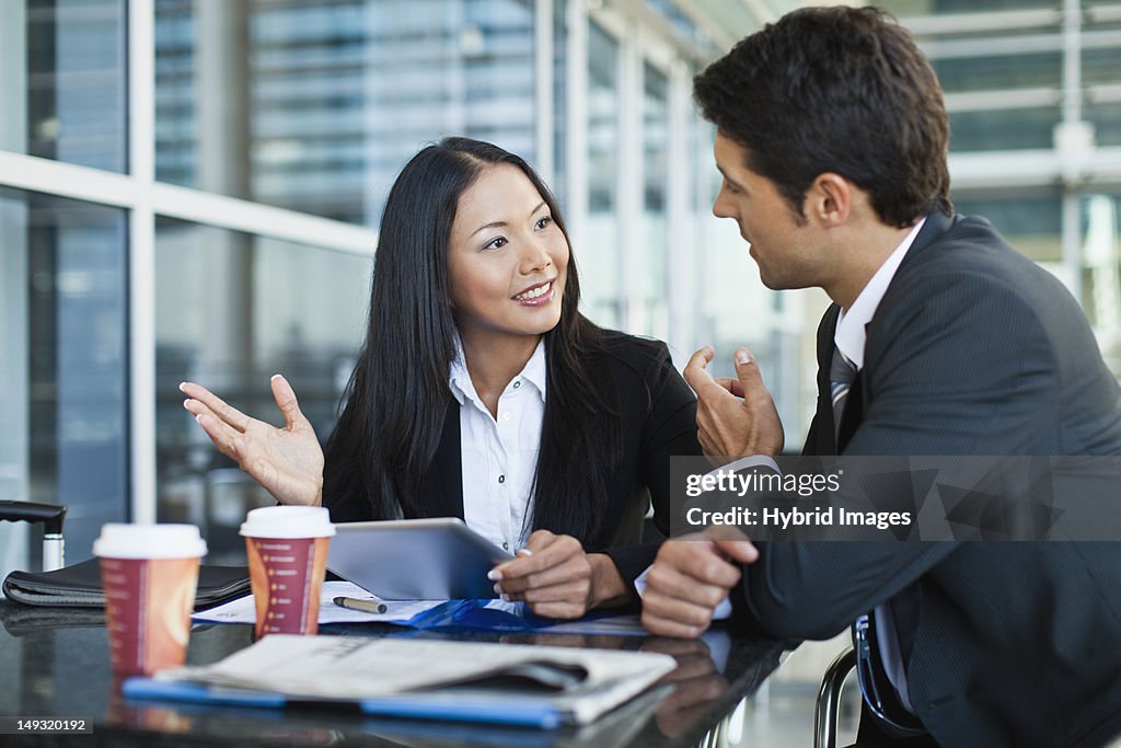 Business people using tablet computer