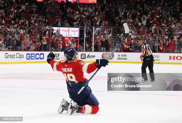 Matthew Tkachuk of the Florida Panthers celebrates with his teammates after scoring the game winning goal on Frederik Andersen of the Carolina...