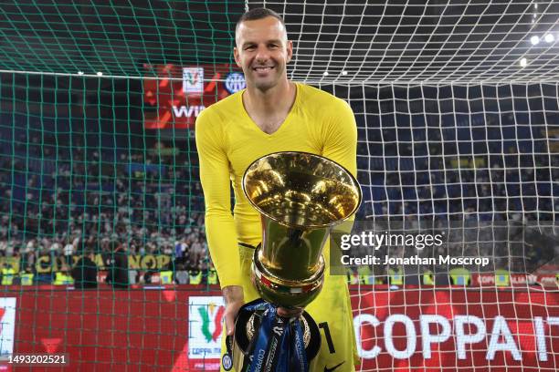 Samir Handanovic of FC Internazionale poses with the trophy following the 2-1 victory in the Coppa Italia Final match between ACF Fiorentina and FC...