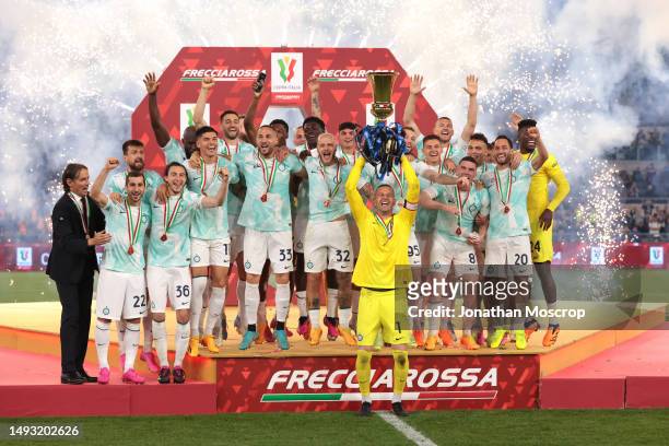 Internazionale players celebrate on the stage with the trophy following the 2-1 victory in the Coppa Italia Final between ACF Fiorentina and FC...