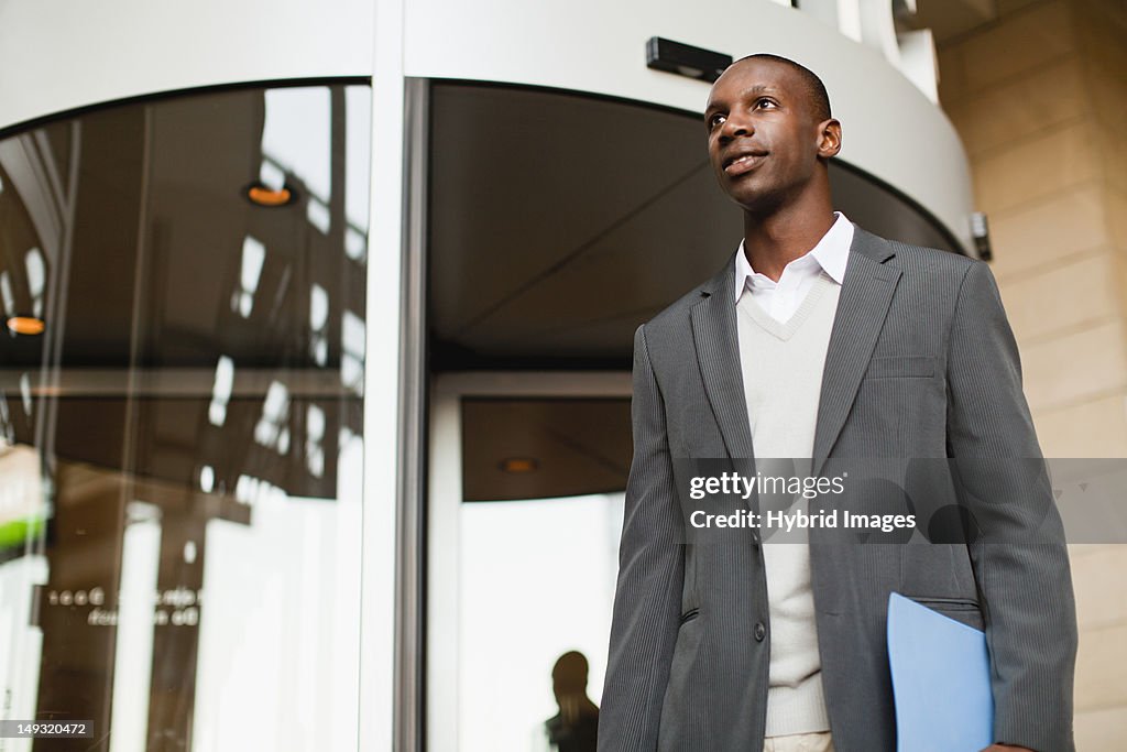 Businessman walking outside building