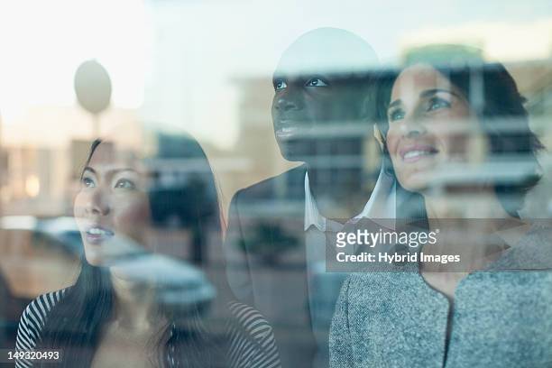 business people looking out window - 3 men looking up stock pictures, royalty-free photos & images