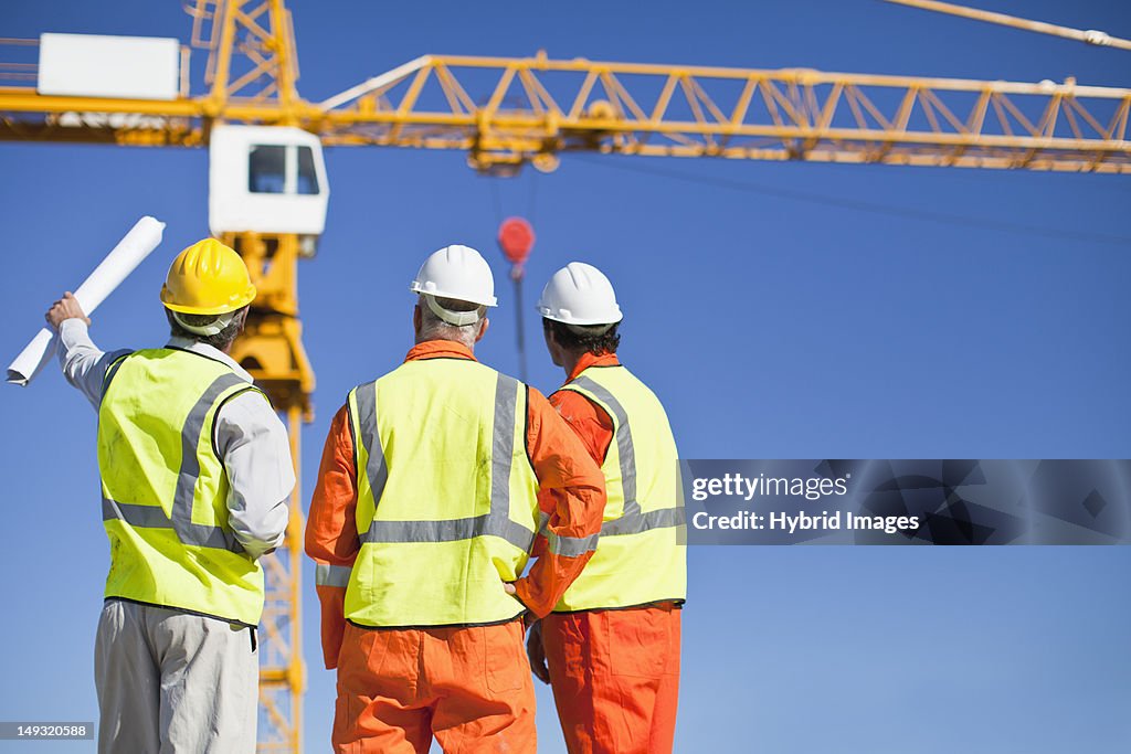 Workers talking at construction site