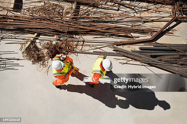 workers walking at construction site - shadow following stock pictures, royalty-free photos & images