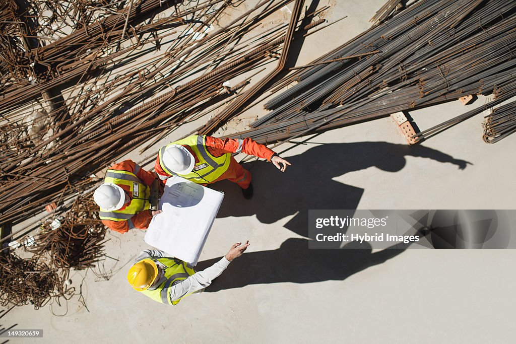 Workers talking at construction site