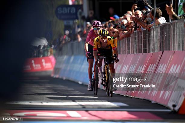 Geraint Thomas of The United Kingdom and Team INEOS Grenadiers - Pink Leader Jersey and Primoz Roglič of Slovenia and Team Jumbo-Visma sprint at...