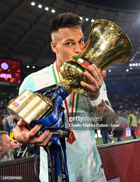 Lautaro Martinez of FC Internazionale celebrate the win with the trophy during the award ceremony at the end of the Coppa Italia Final match between...