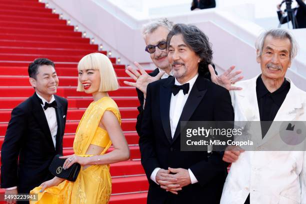 Producer Koji Yanai, Aoi Yamada, Director Wim Wenders, Director Kōji Yakusho and Min Tanaka depart the "Perfect Days" red carpet during the 76th...