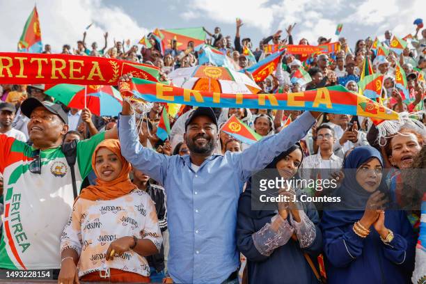 Attendees of the official 32nd Anniversary of Independence celebration wave flags and dance during the celebration at Asmara Stadium on May 24, 2023...
