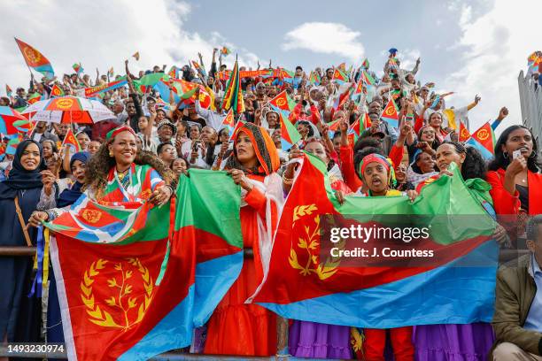 Attendees of the official 32nd Anniversary of Independence celebration wave flags and dance during the celebration at Asmara Stadium on May 24, 2023...