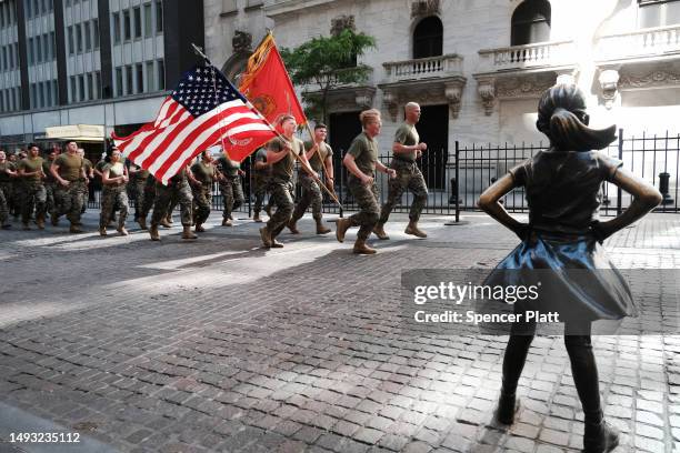 Members of the Marine Corps run past the New York Stock Exchange during Fleet Week in the city on May 25, 2023 in New York City. Nine ships,...