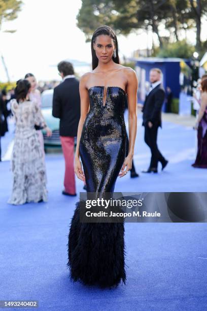 Cindy Bruna is pictured with the new Aston Martin DB12 during the amfAR Cannes Gala 2023 at Hotel du Cap-Eden-Roc on May 25, 2023 in Cap d'Antibes,...