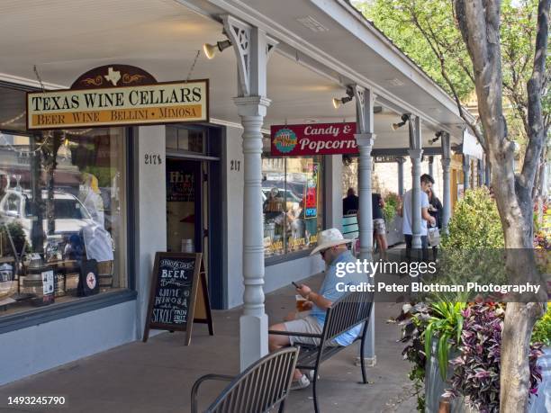 downtown fredericksburg texas along main street - fredericksburg tx stock pictures, royalty-free photos & images