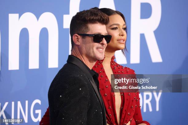 Robin Thicke and April Love Geary attend the amfAR Cannes Gala 2023 at Hotel du Cap-Eden-Roc on May 25, 2023 in Cap d'Antibes, France.