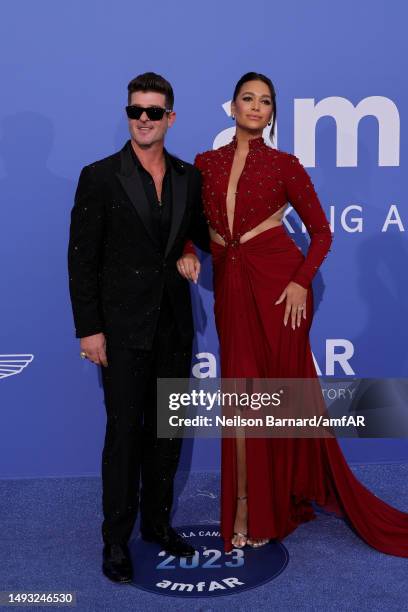 Robin Thicke and April Love Geary attend the amfAR Cannes Gala 2023 at Hotel du Cap-Eden-Roc on May 25, 2023 in Cap d'Antibes, France.