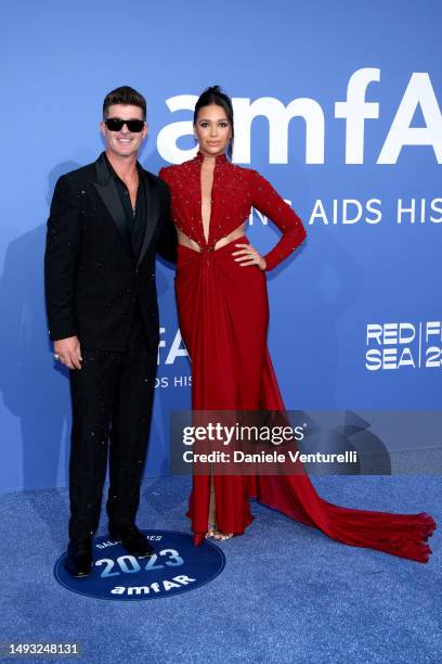 Robin Thicke and April Love Geary attend the amfAR Cannes Gala 2023 at Hotel du Cap-Eden-Roc on May 25, 2023 in Cap d'Antibes, France.