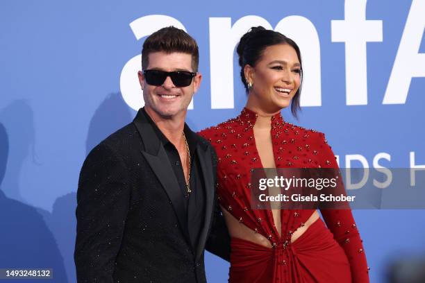 Robin Thicke and April Love Geary attend the amfAR Cannes Gala 2023 at Hotel du Cap-Eden-Roc on May 25, 2023 in Cap d'Antibes, France.