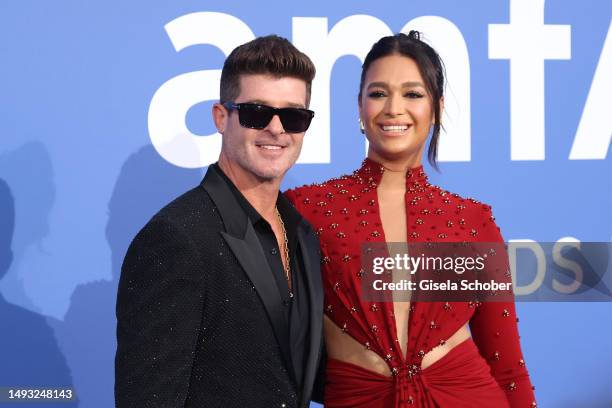 Robin Thicke and April Love Geary attend the amfAR Cannes Gala 2023 at Hotel du Cap-Eden-Roc on May 25, 2023 in Cap d'Antibes, France.