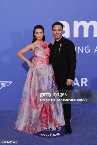 Amy Jackson and Ed Westwick attend the amfAR Cannes Gala 2023 at Hotel du Cap-Eden-Roc on May 25, 2023 in Cap d'Antibes, France.